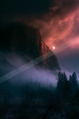 A black-toned moody photograph of alp, valley, cliff.