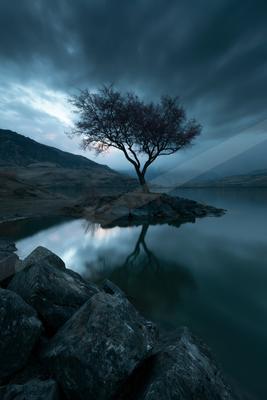 A mysterious long exposure water scene of a lake, reflection.