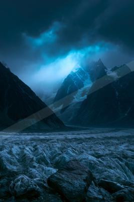 A moody landscape of mountains.
