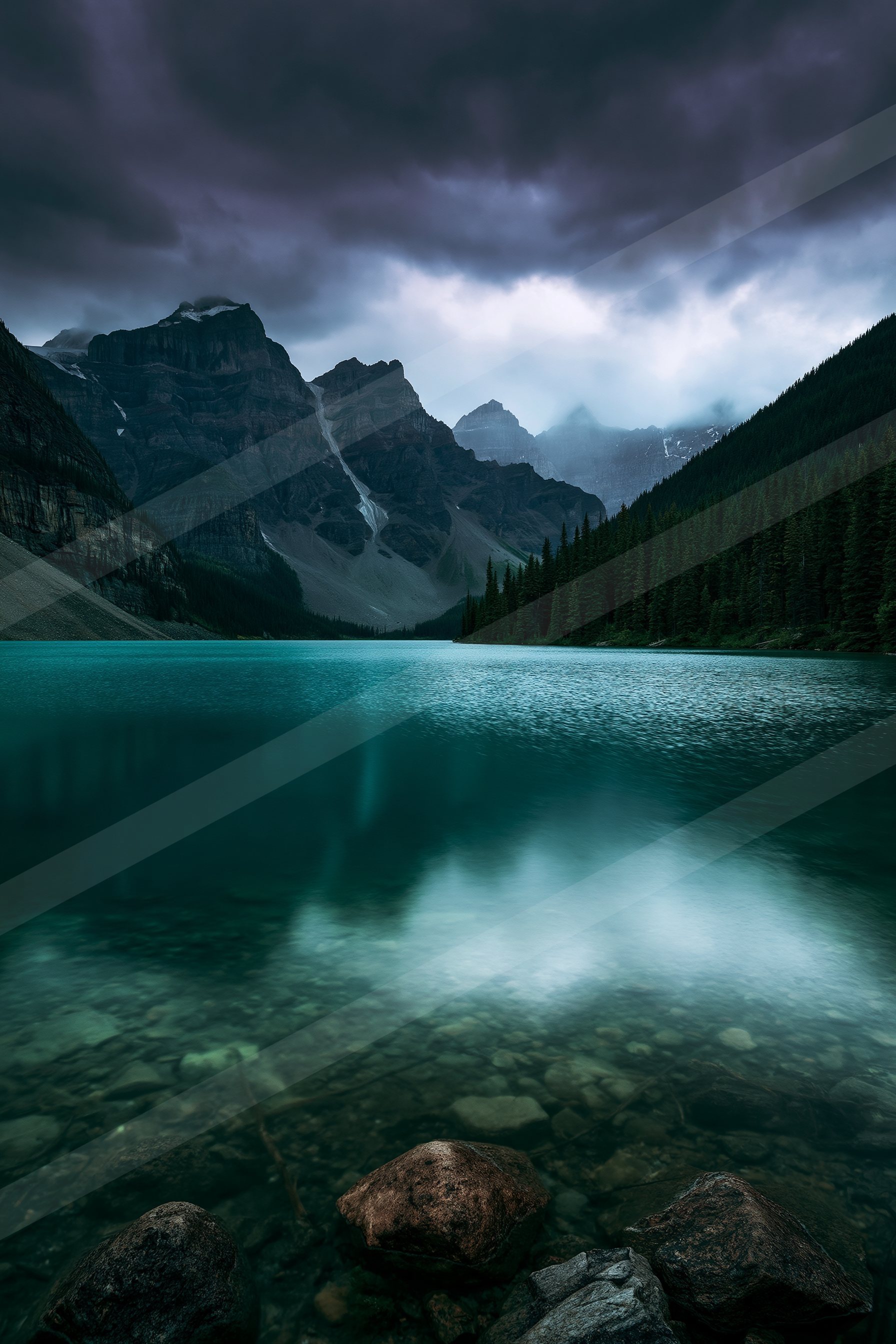 A serene mountain lake surrounded by rugged peaks under a moody, dark sky.