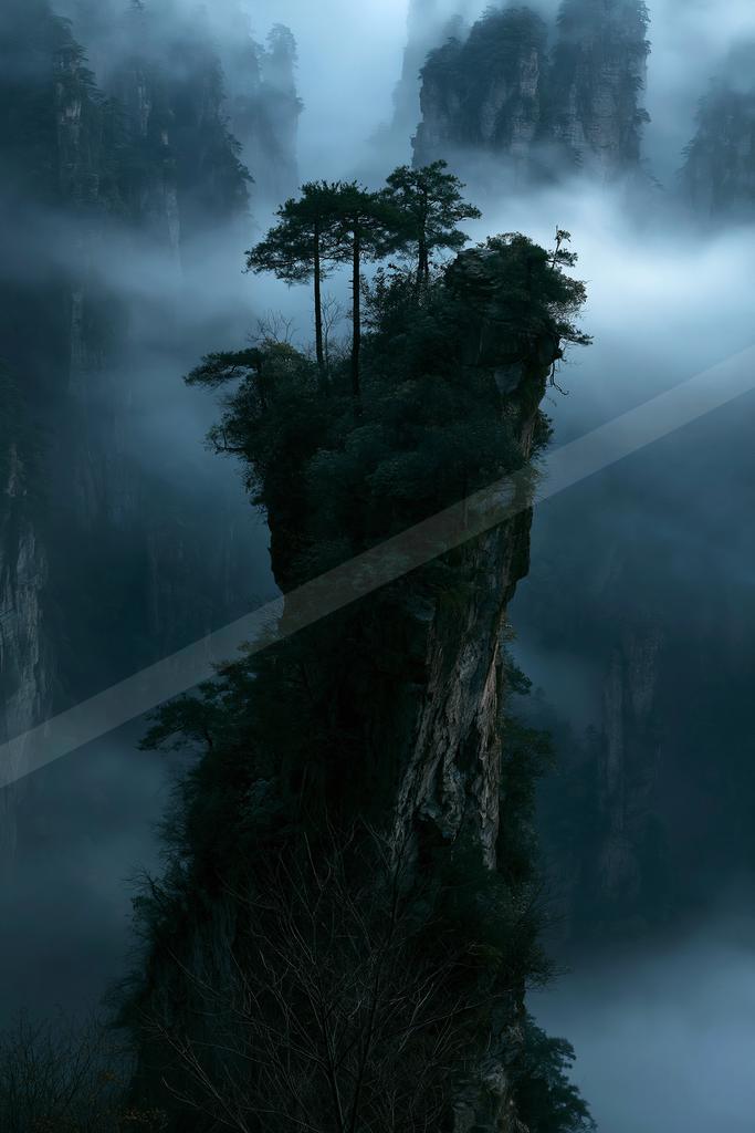 A dramatic landscape of mountains, trees, forest.