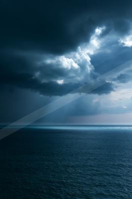 A dramatic sky scene of storm, ocean, clouds.