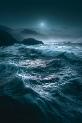 A blue hour water scene of ocean.