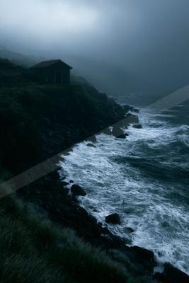 A night long exposure water scene of ocean, storm, fog.