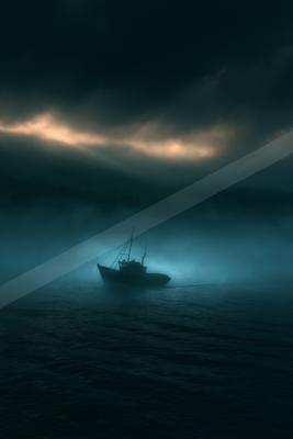 A dramatic still life of boat, ocean, fog.