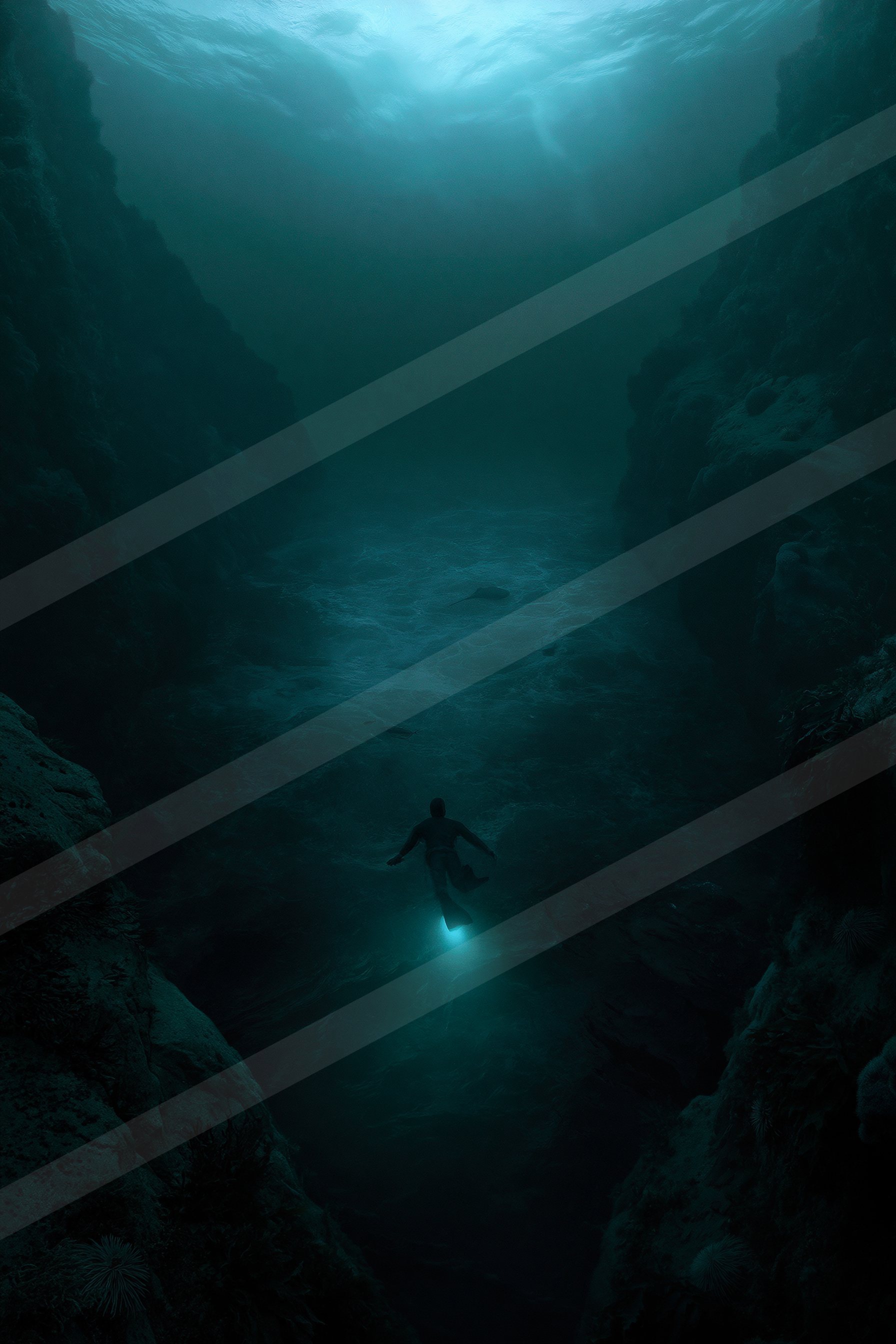 A diver illuminated by a blue light explores the depths of an underwater canyon surrounded by rocky walls.