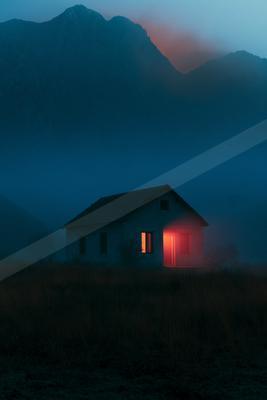 A night long exposure sky scene of sunrise, building, sunset.