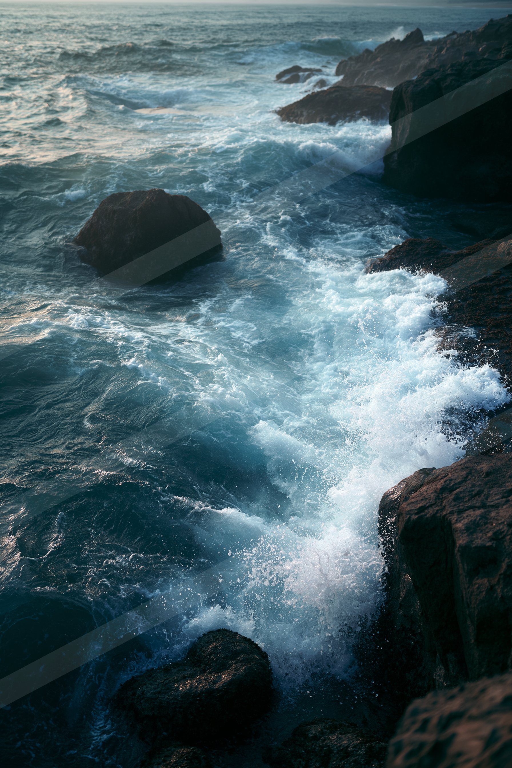 An ethereal motion blur water scene of an ocean waves, rocks.