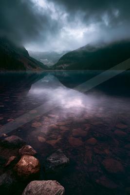 A serene long exposure water scene of lake, fog.
