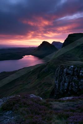 A serene sky scene of sunrise, valley, mountains.