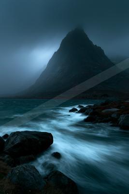 A mysterious long exposure landscape of a sand dune, fog.