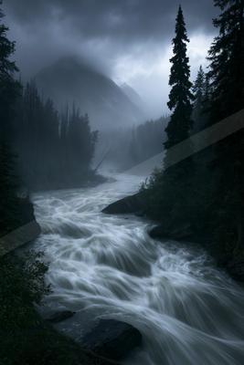 A brown-toned moody photograph of valley, lakeside, alp.