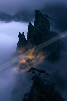 A moody landscape of mountains.