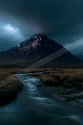 A dramatic long exposure landscape of mountains, river, valley.