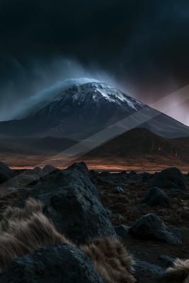 A night landscape of mountains, valley, storm.