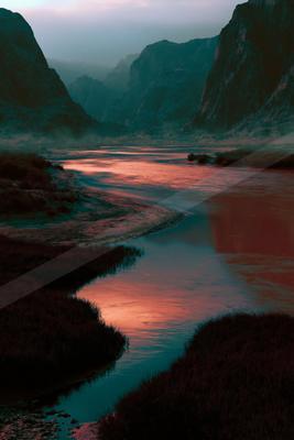 A moody water scene of river, lake, sunset.