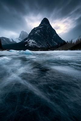 A moody landscape of mountains.
