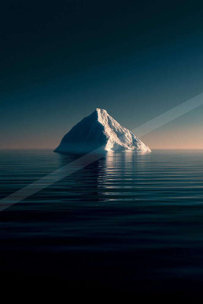 A solitary white iceberg floats in a vast, calm dark ocean under a deep blue twilight sky, its reflection visible on the water's surface.