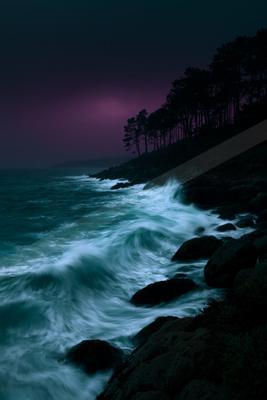 A blue hour long exposure water scene of ocean.