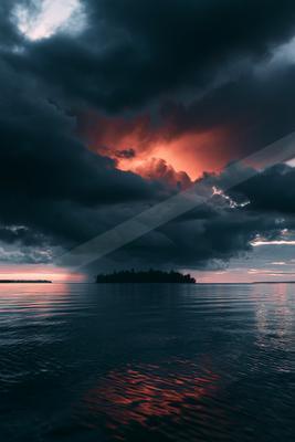 A blue hour sky scene of storm, clouds, sunset.
