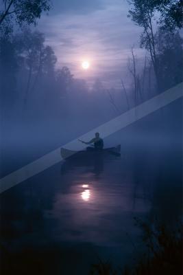 A night water scene of lake, fog.