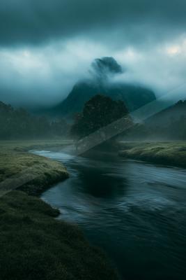 An ethereal long exposure water scene of a river, fog.