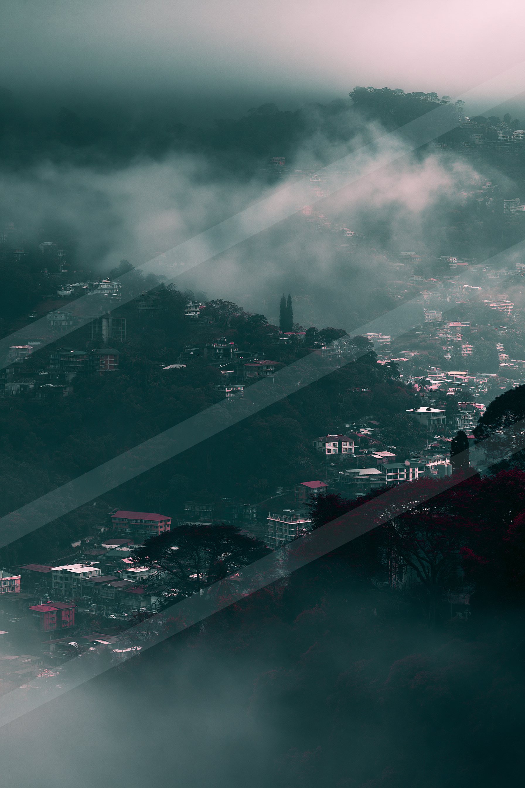 A moody double exposure landscape of a valley, fog.