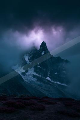 A blue hour landscape of mountains.