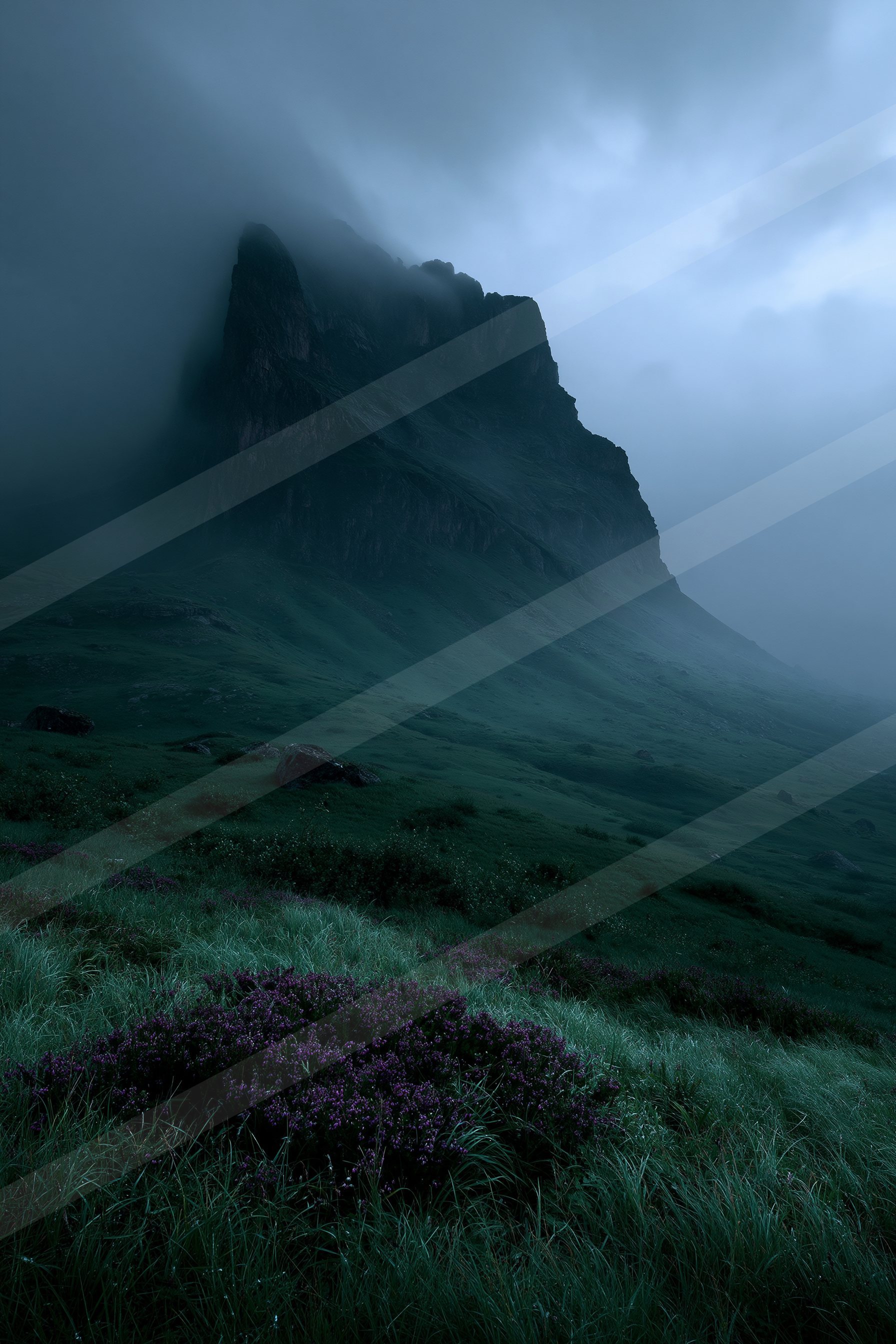 A towering mountain peak shrouded in mist overlooks a vast grassland dotted with purple wildflowers, creating an atmospheric dusk scene.