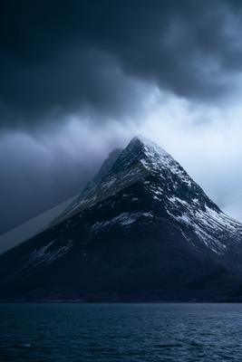 A moody landscape of mountains.
