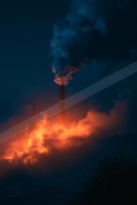 A black-toned moody photograph of volcano, torch, fire screen.
