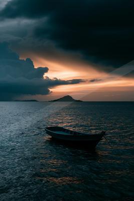 A moody sky scene of sunset, storm, clouds.
