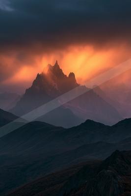 A moody landscape of mountains.