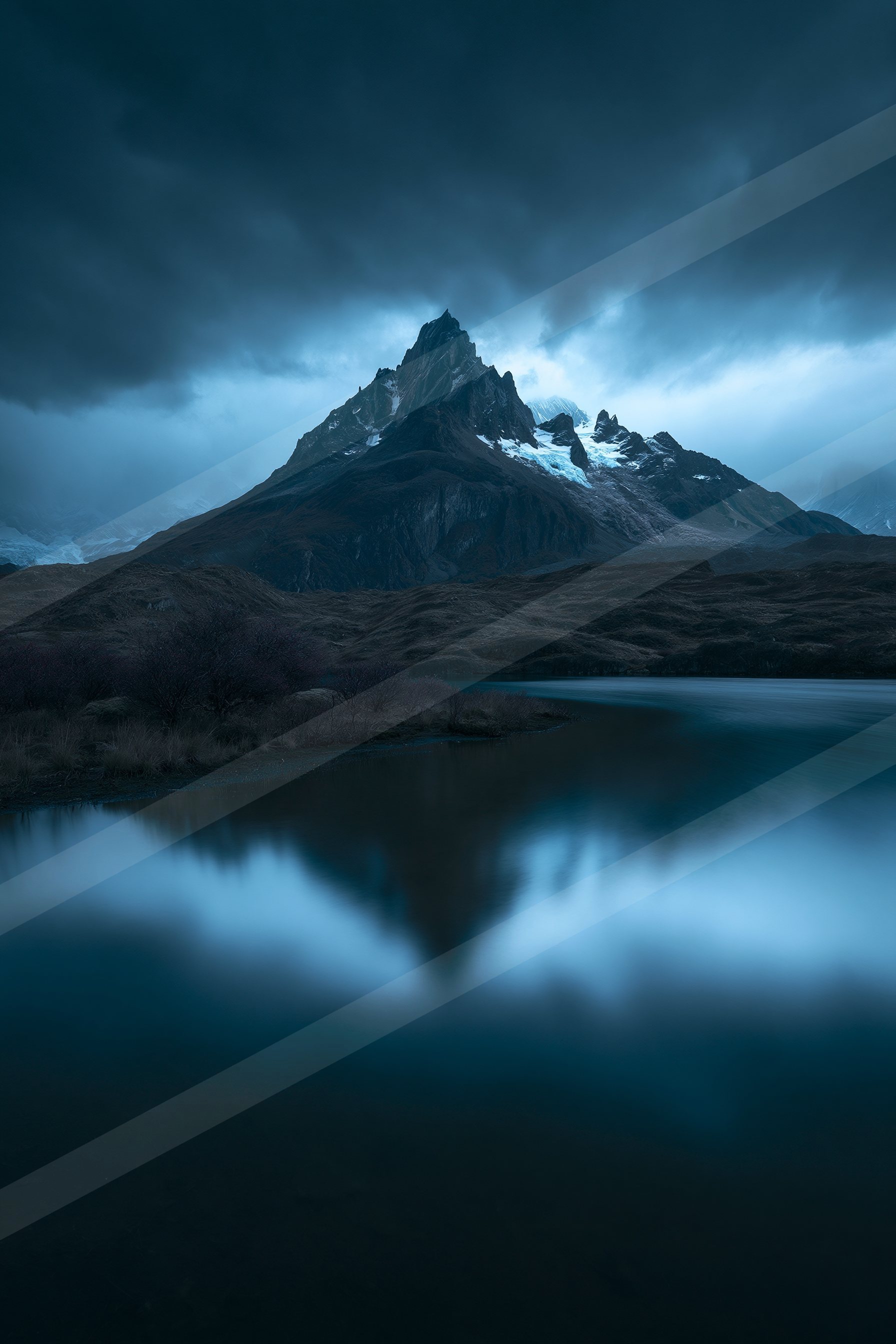 A blue hour long exposure landscape of a mountains, reflection.
