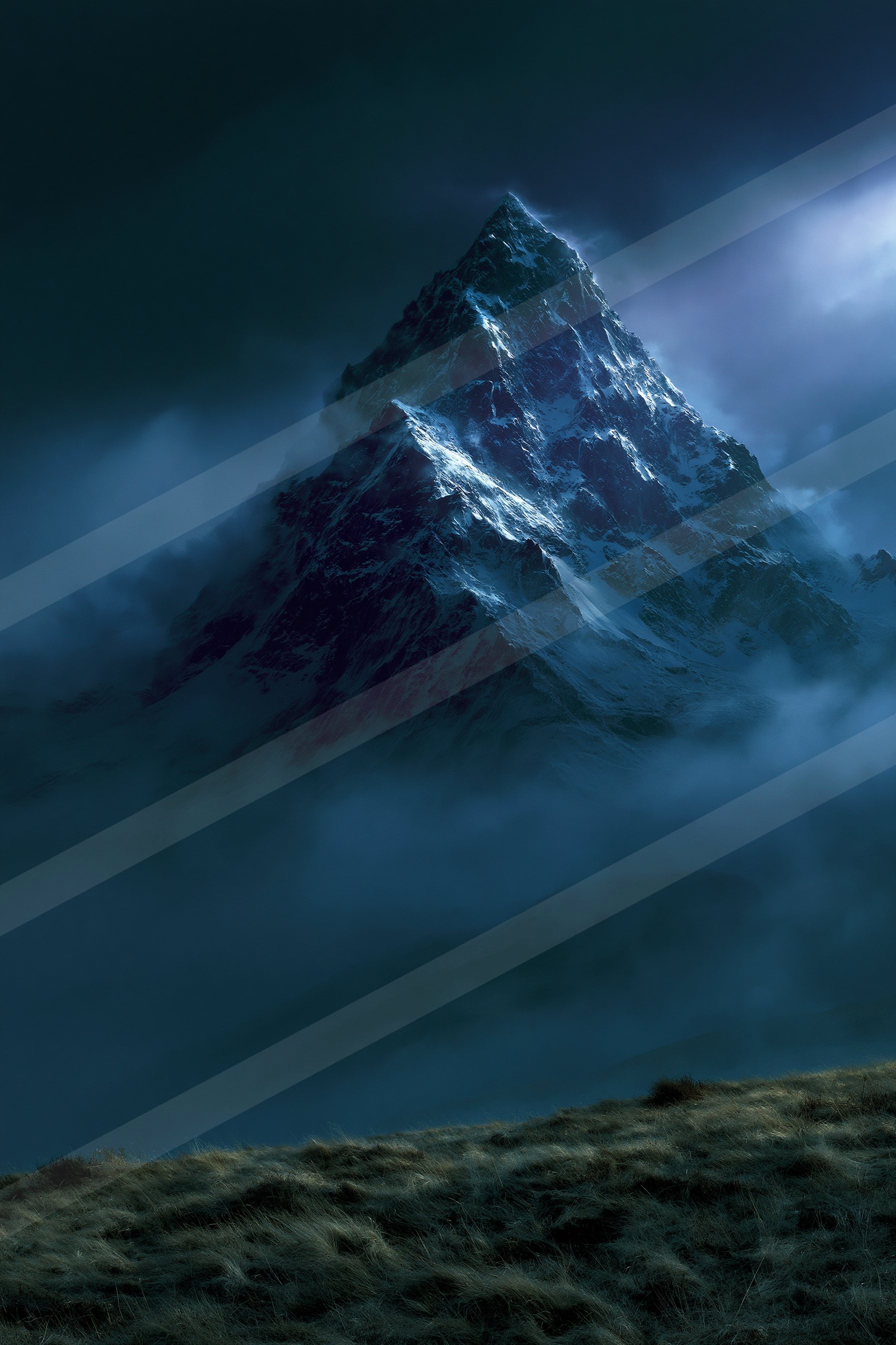 An ethereal landscape of a mountains, fog.