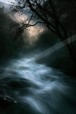 A serene water scene of river, waterfall.