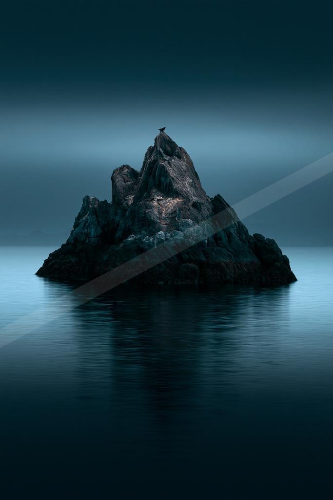 A black-toned moody photograph of promontory, beacon, seashore.