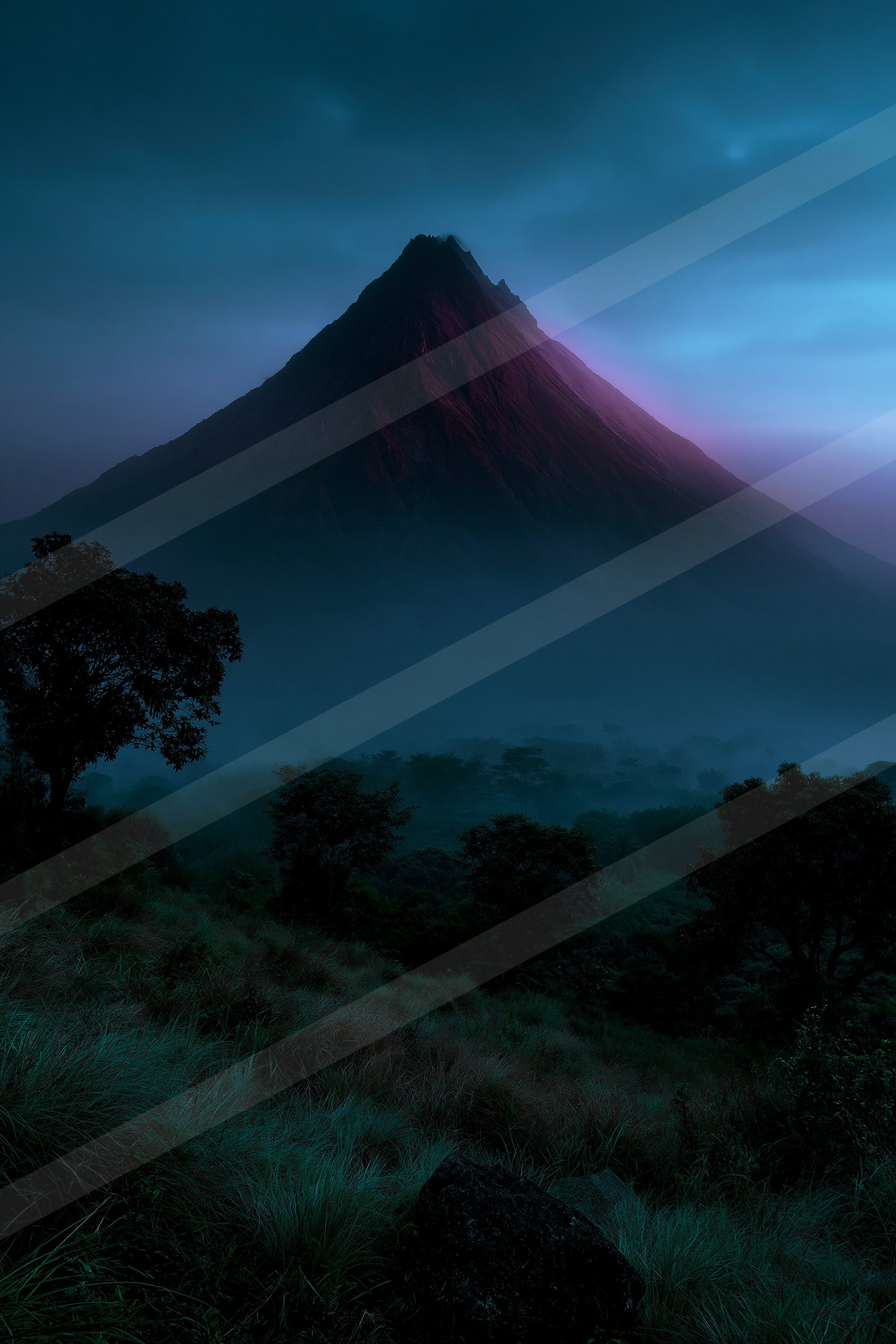 A blue hour landscape of a volcano.