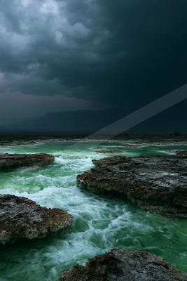 A dramatic long exposure sky scene of storm, ocean.