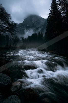 A night long exposure water scene of river, fog.