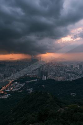 A dramatic sky scene of storm, city skyline, clouds.