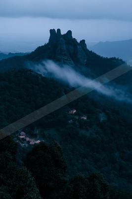 A night landscape of mountains, fog.