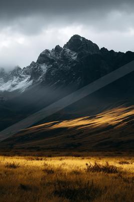 A moody landscape of mountains.
