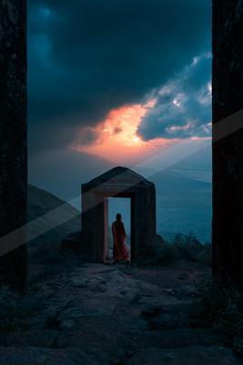 A blue hour sky scene of sunrise, clouds, silhouette.