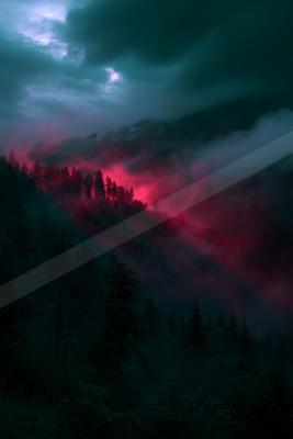 A dramatic sky scene of sunrise, sunset, mountains.