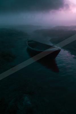 A small red boat floats in a narrow waterway through a misty marsh under a dramatic purple and dark cloudy sky at dusk.