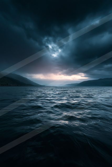 A blue hour panorama water scene of an ocean, ripples.