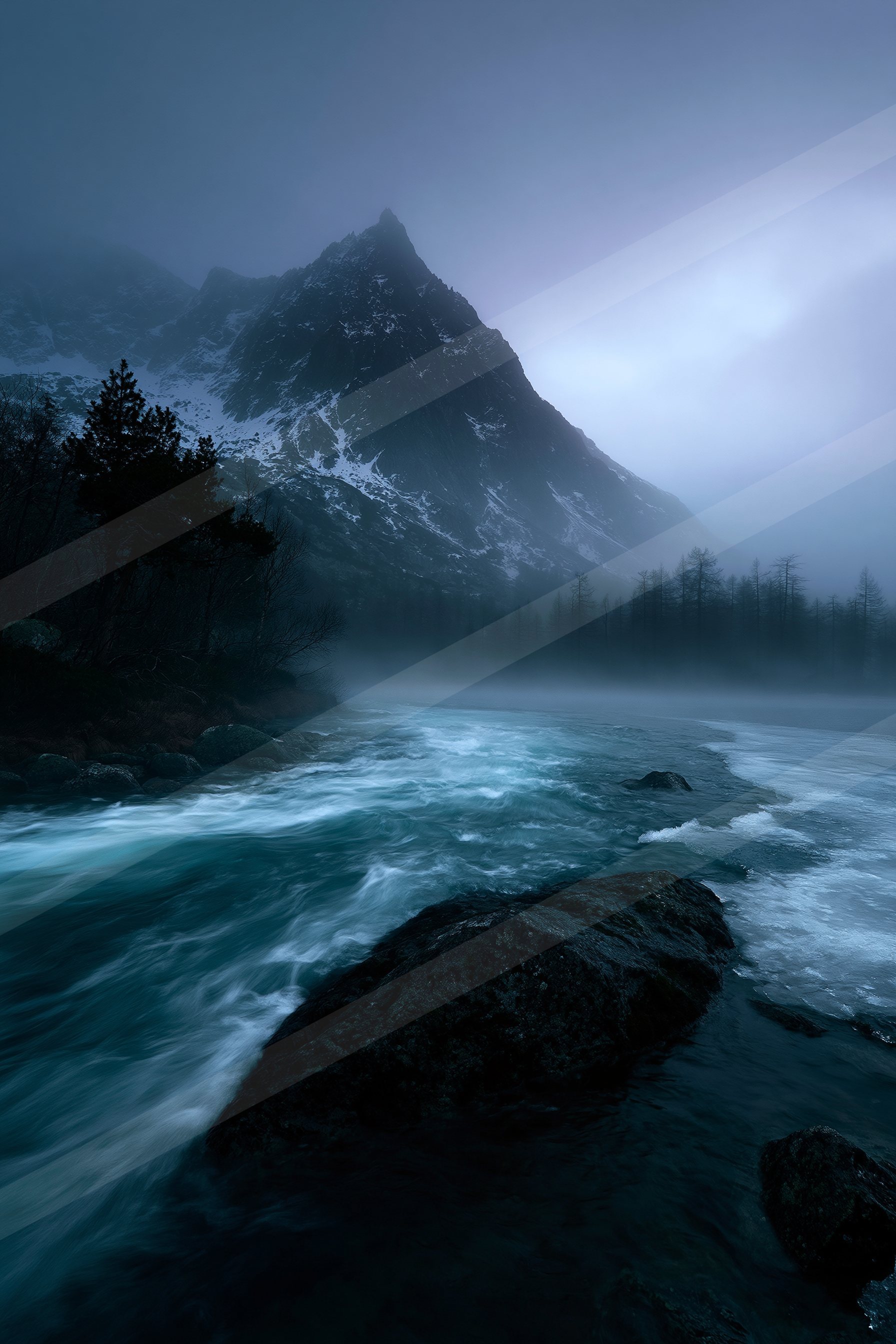 A blue hour long exposure water scene of a river, fog.