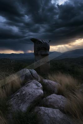 A night sky scene of storm, clouds, valley.