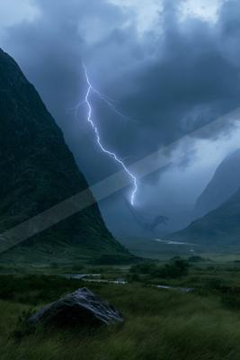 A moody sky scene of storm, mountains.